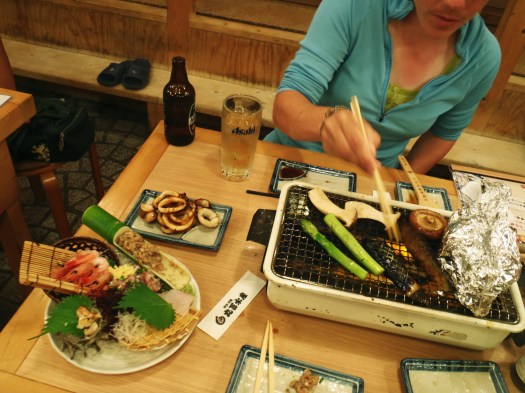Best meal ever: a plate of sashimi and grill-it-yourself squid, salmon, and veggies. 
