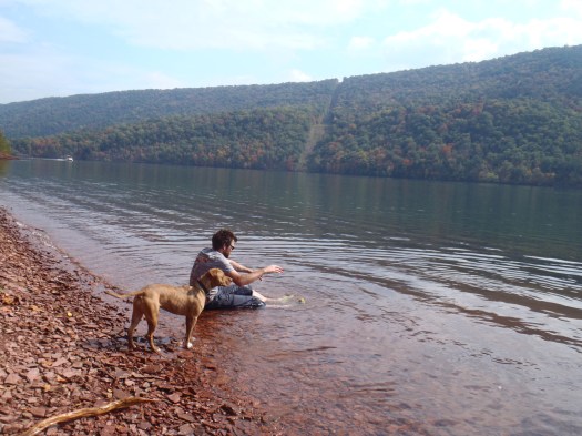 The dog and the dude take a dip.
