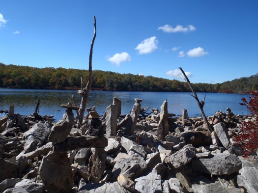 Rock sculptures along shore.