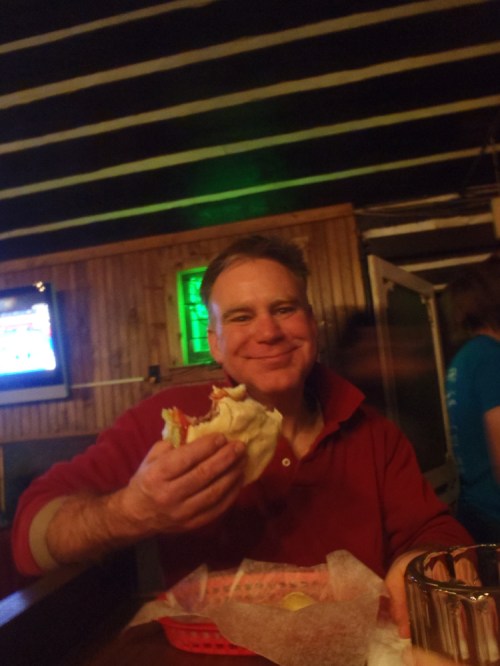 John's enjoying that burger. 