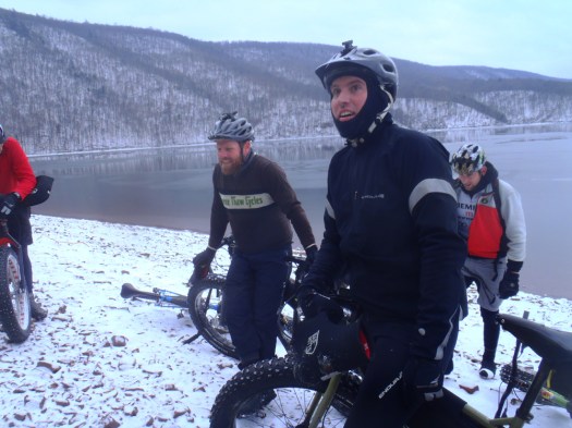 Watching other riders bushwack down the hill to the lake.
