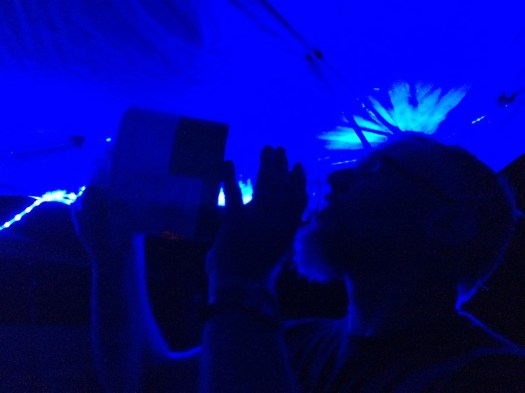 Mark goes at the hot apple pie under the blue LED lights we set up in the easy-up.